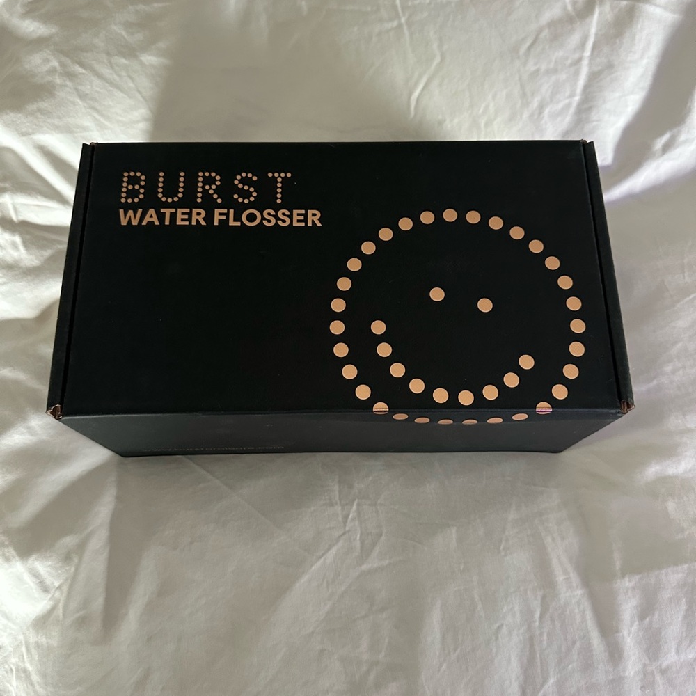 New in box- Burst water flosser